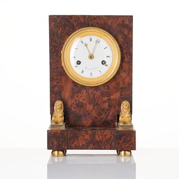 A French Empire burr-amboyna and ormolu mounted 'pendule borne' mantel clock by Barrand (master in Paris 1805-32).