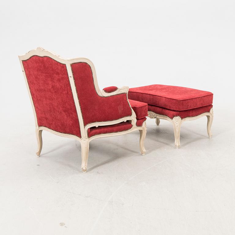 A Louis XV style armchair with stool second part of the 20th century.