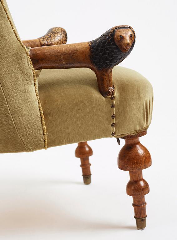 Swedish designer, a stained and carved birch folkart chair, ca 1900.