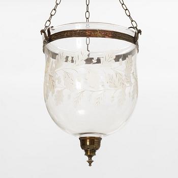 A glass and metal lantern, early 20th century.