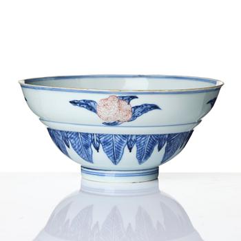 A blue and white and copper-red 'peaches' bowl, Qing dynasty.