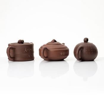 A group of three Chinese yixing teapots, 1960-80s.