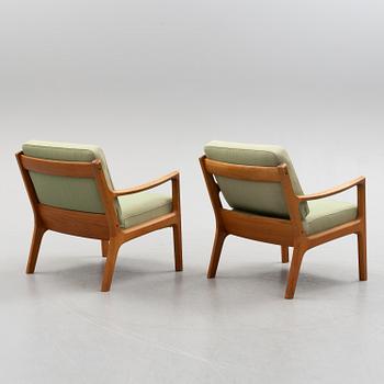 A pair of Ole Wanscher 'Senator' teak easy chairs, for France & Son, Denmark, second half of the 20th century.