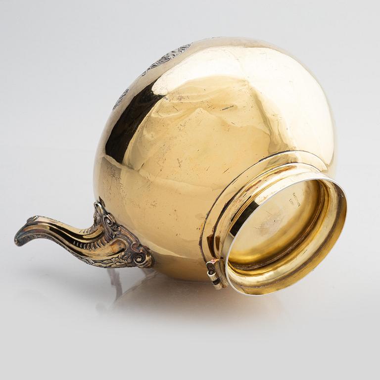An English silver-gilt teapot with stand and burner, mark of Richard Sibley I, London 1825.