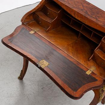 A rococo rosewood parquetry and gilt-brass mounted secretaire by J. H. Reimers (master in Stockholm 1754-73).