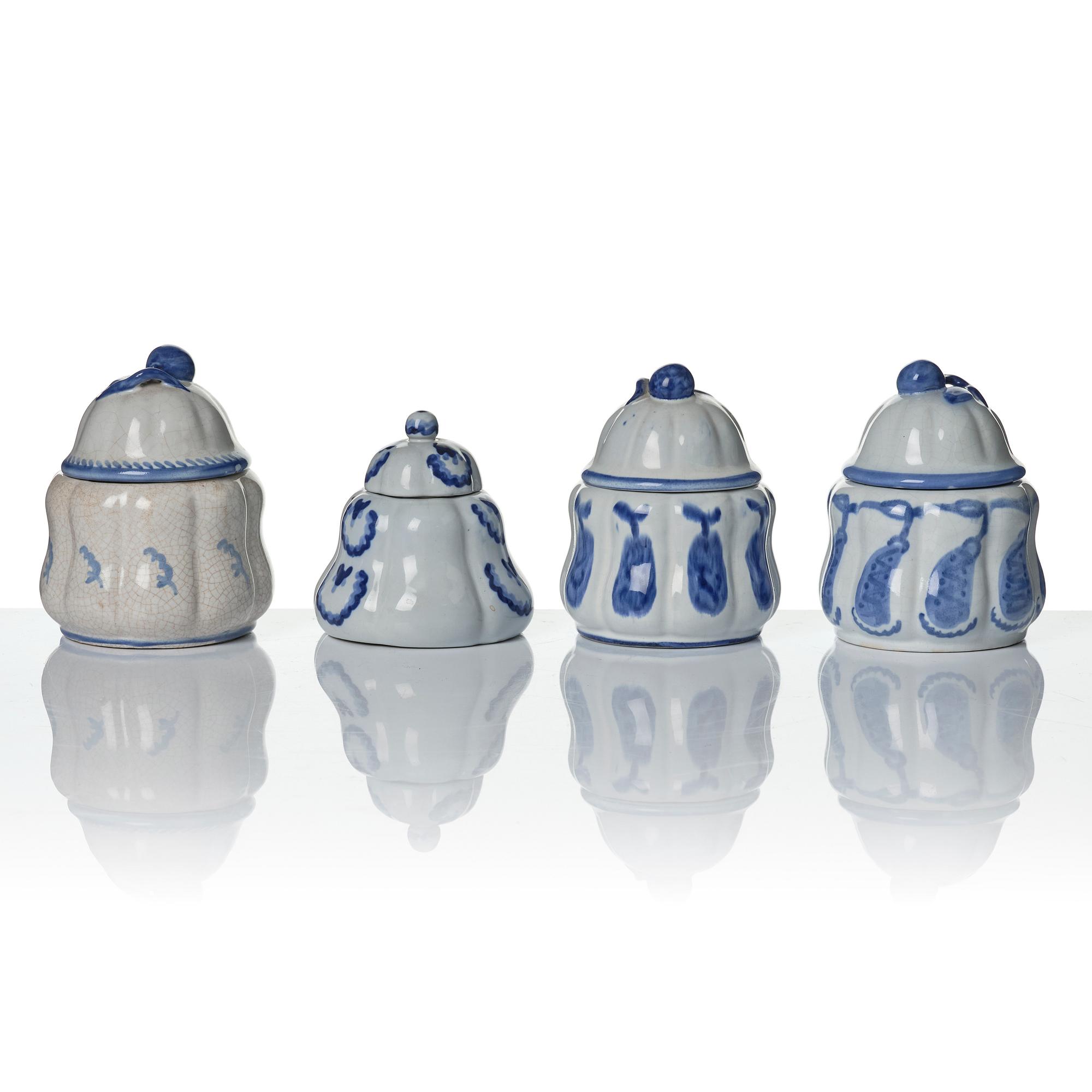 Wilhelm Kåge, eleven pieces of faience including jars, inkwells and a tulip vase, Gustavsberg, Sweden, 1919-1920.