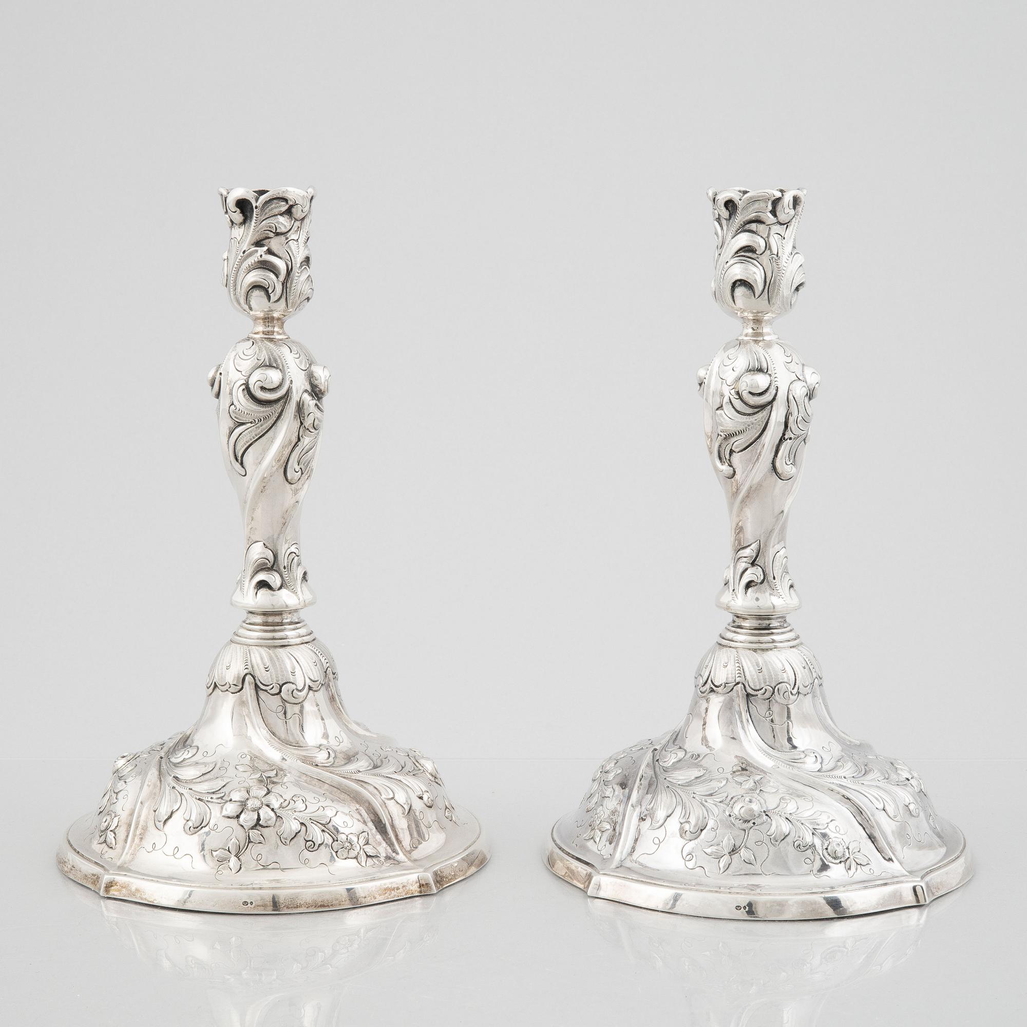 A pair of Rococo style sterling silver candelsticks, Swedish import mark.