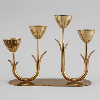 A candelabrum and one camdelstick by Gunnar Ander for Ystad Metall, 20th century.