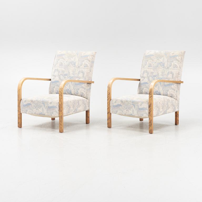 A pair of 1930's armchairs.