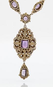 A parure comprising a necklace, a pair of earrings and a ring.