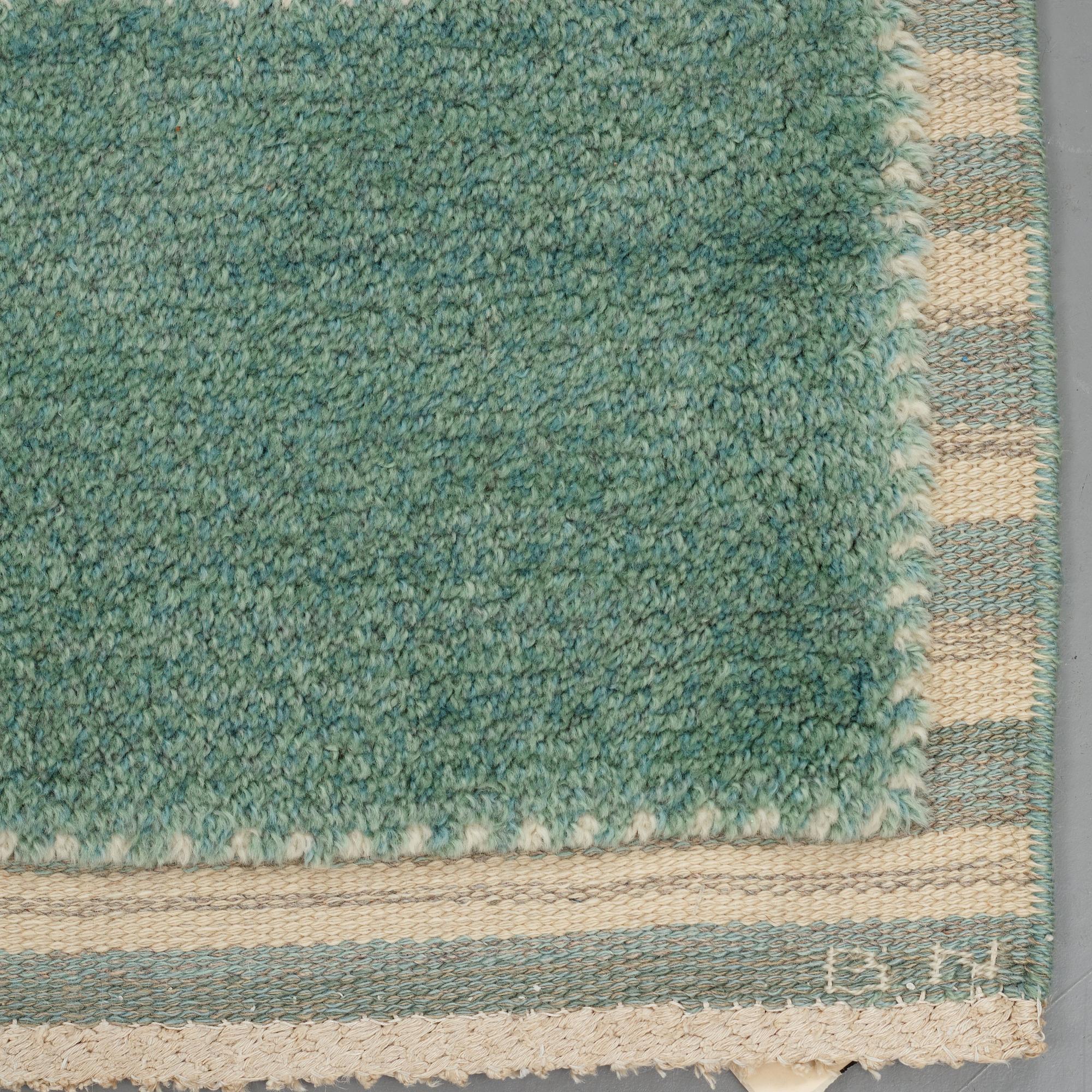 Barbro Nilsson, A carpet, "Gyllenrutan grön", knotted pile in relief ca 240,5-241,5 x 135,5-138 cm, signed AB MMF BN.