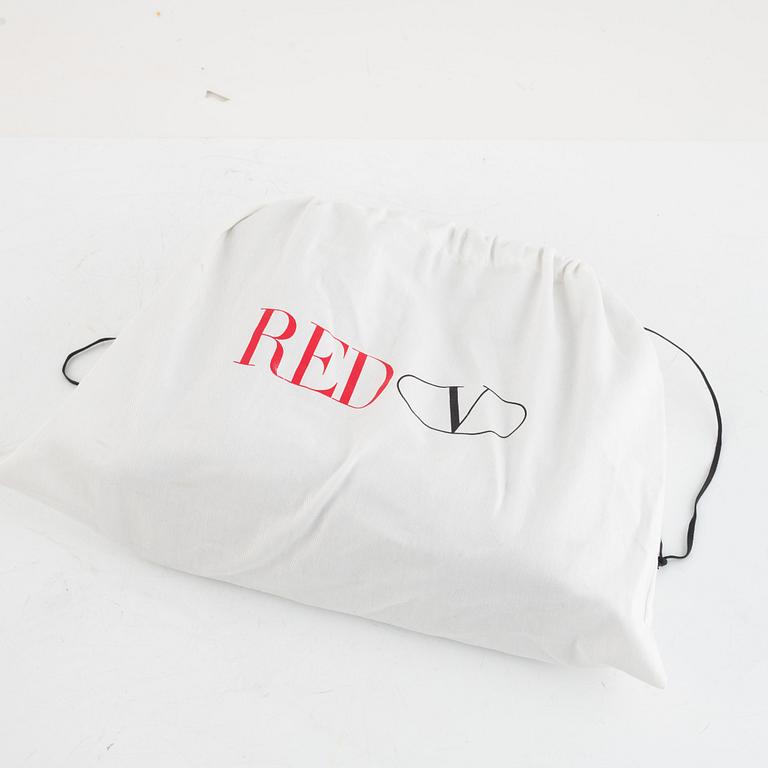 Valentino Red, A black leather snake bag.