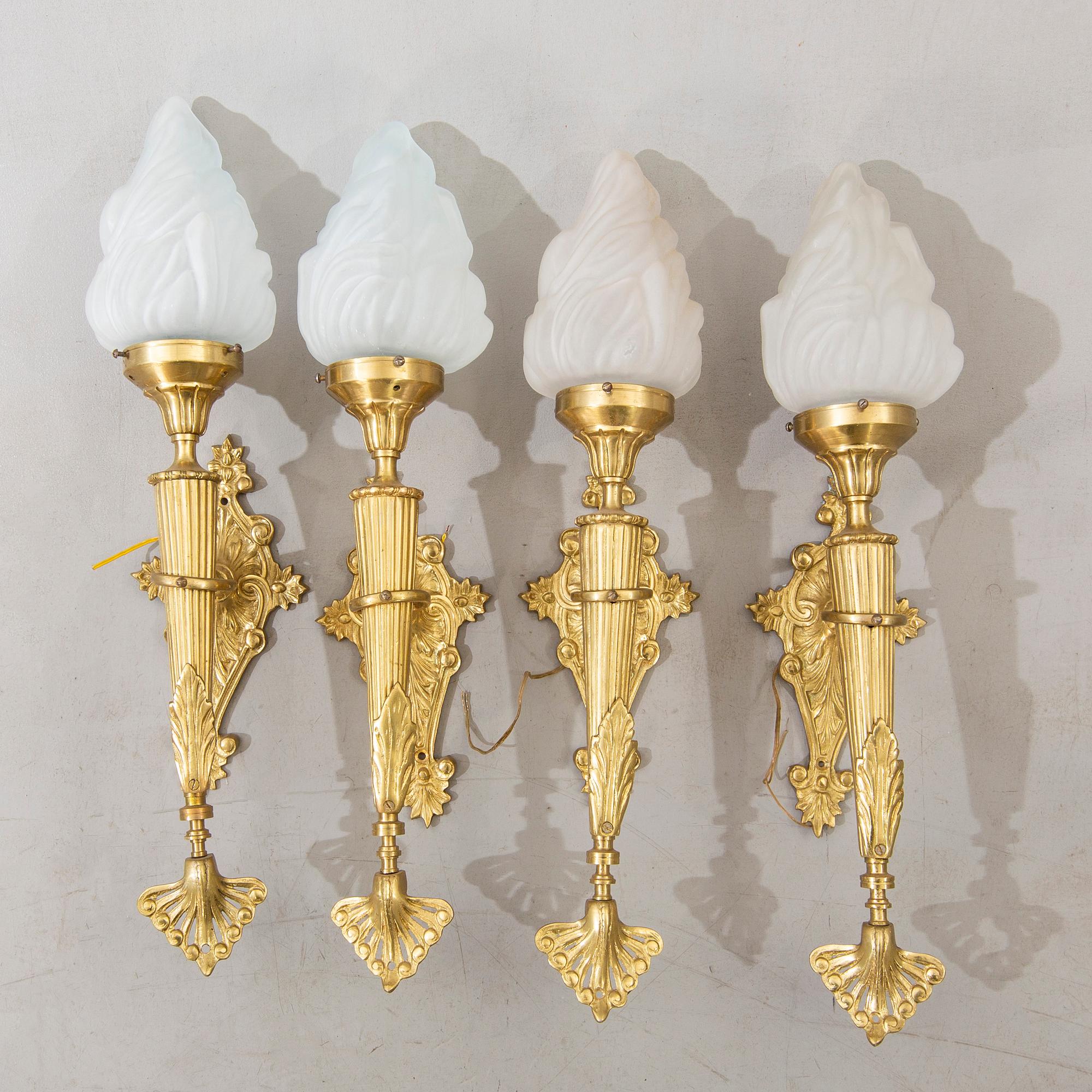 A set of four wall lamps later part of the 20th century.