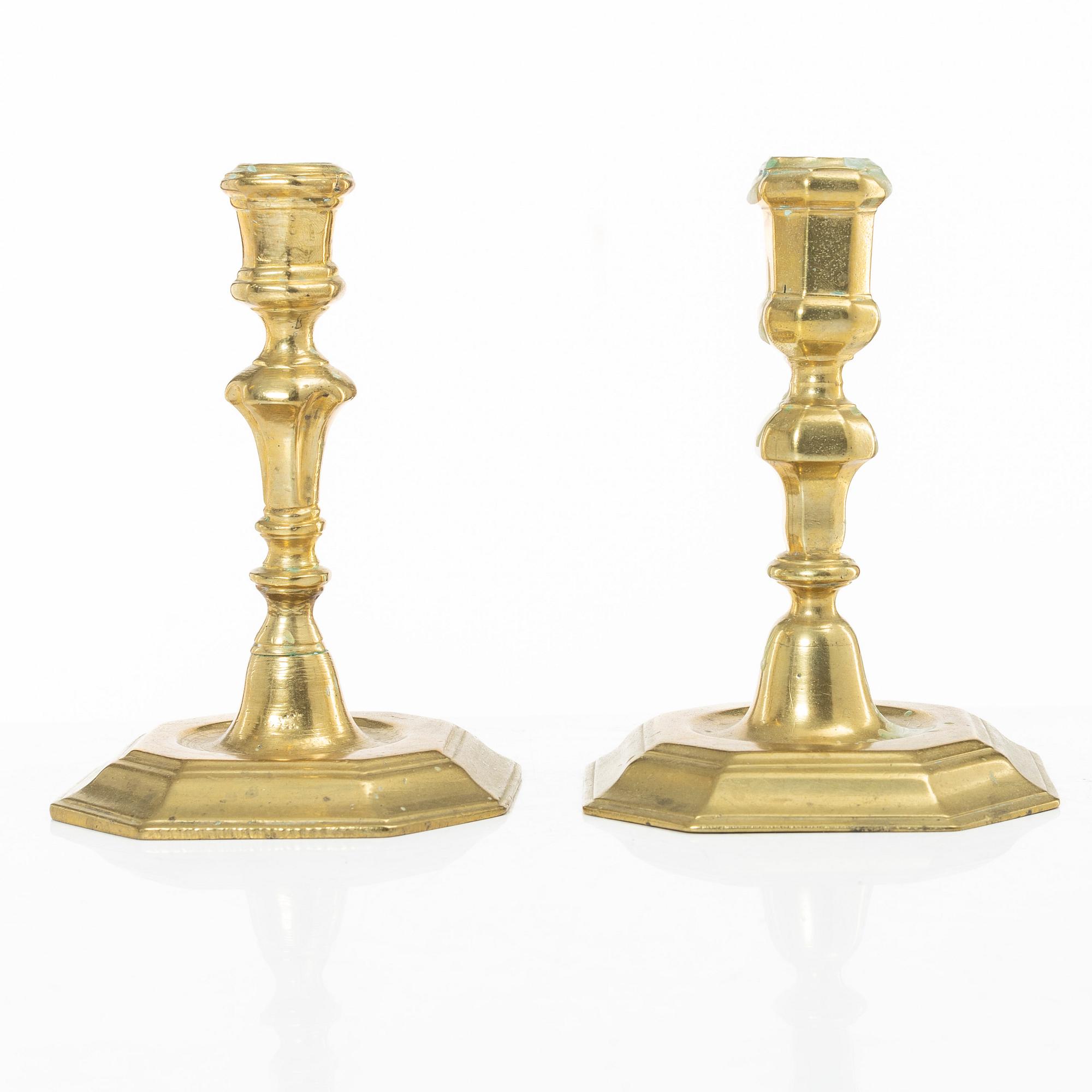 A set of two Northern European late baroque brass candlesticks, first part 18th century.