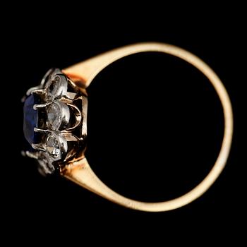 RING, 18 k guld, 10 briljanter totalt 0.90 ct samt syntetisk safir.