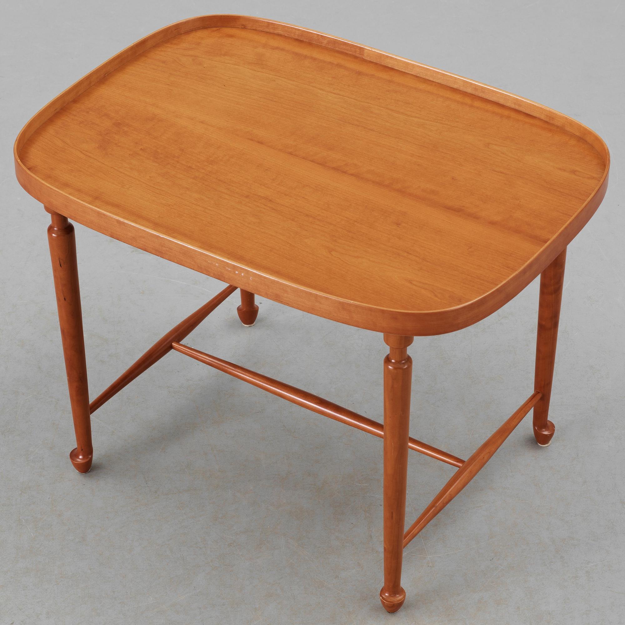 A Josef Frank mahogany table by Svenskt Tenn.
