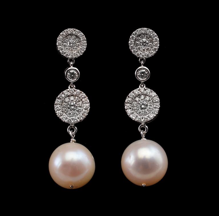 A PAIR OF EARRINGS, brilliant cut diamonds c.0.83 ct. South sea pearls 11 mm. 18K white gold. Weight 9,9 g.