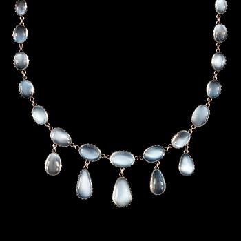 1. A cabochon-cut moonstone necklace. Made by C G Hallberg, Stockholm 1907.
