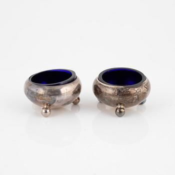 Eight salt cellars and shakers, silver and other white metal, England, 1800-1908.