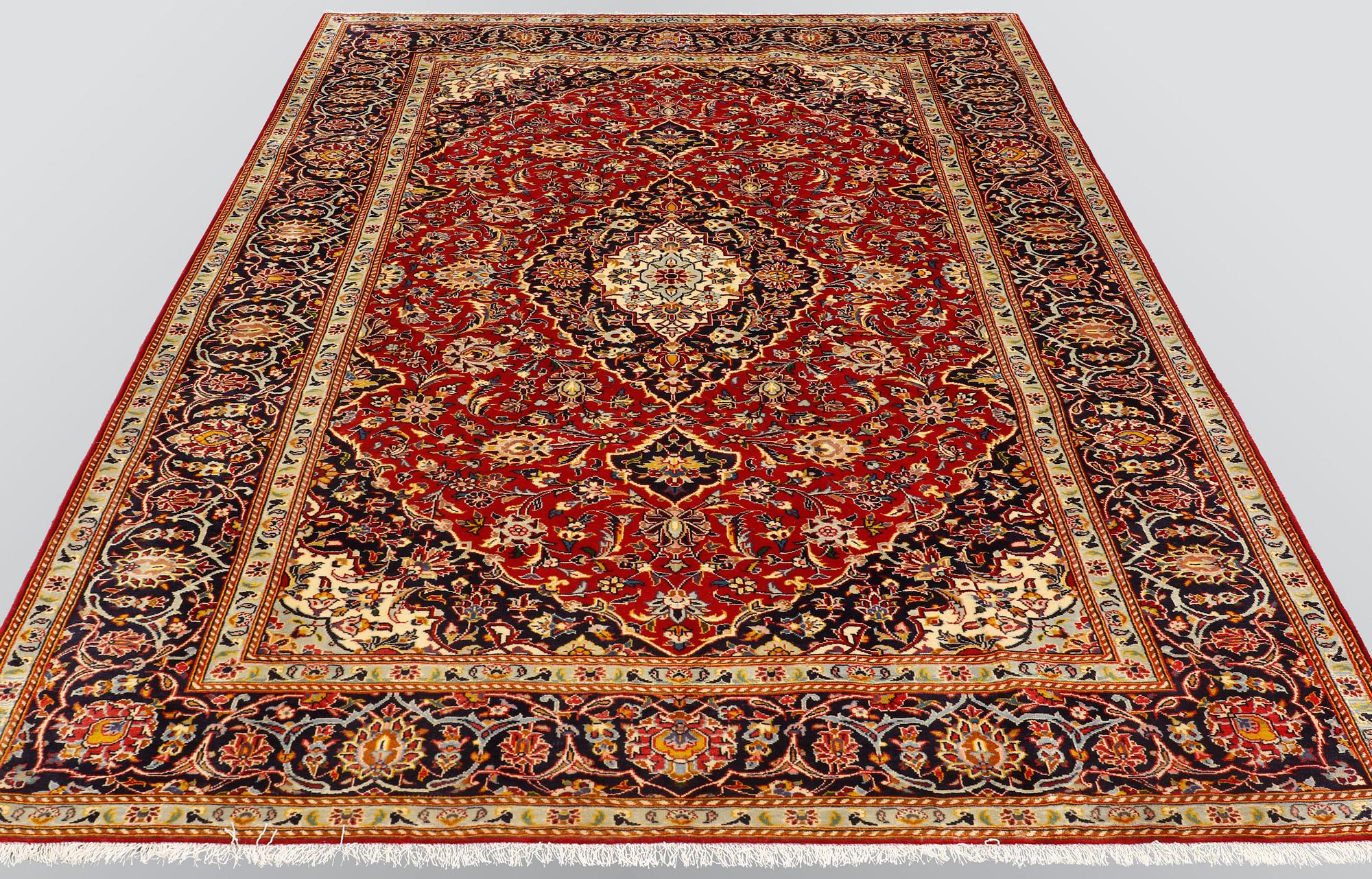 A carpet, Kashan, signed, ca 300 x 204 cm.