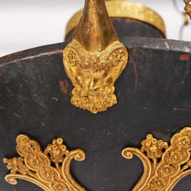 A patinated and ormolu six-light Empire chandelier, Stockholm, first part 19th century.