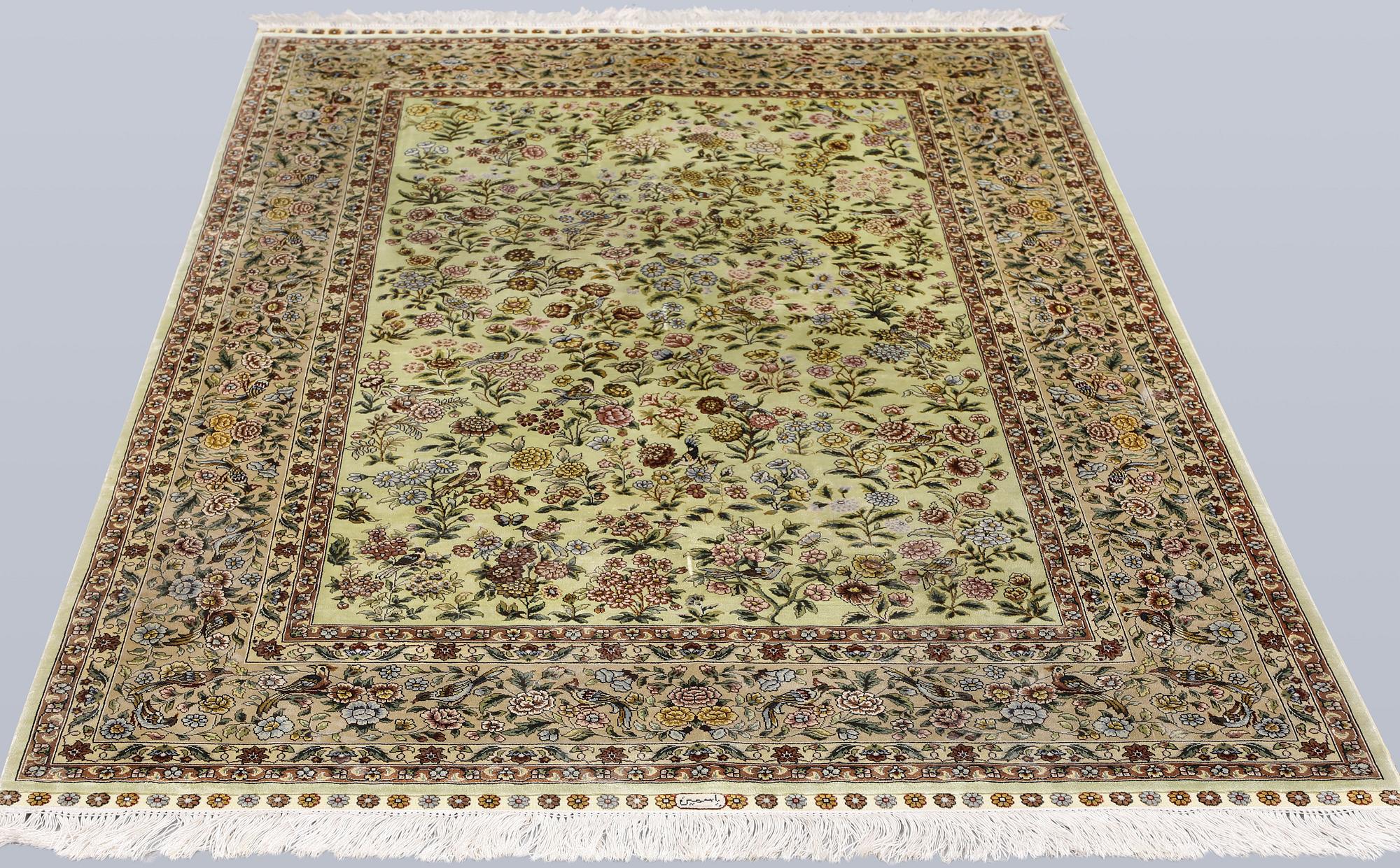 An Oriental silk rug, approx. 124 x 183 cm.