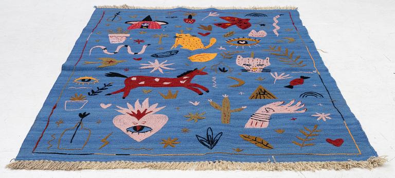 A hand-embroidered Kelim rug, 185 x 124 cm.
