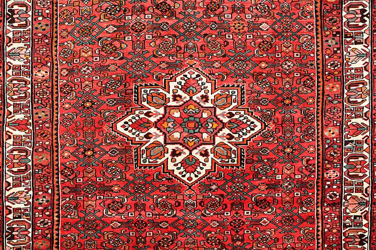 An oriental carpet, c. 325 x 222 cm.