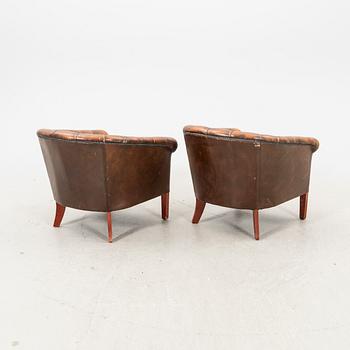 A pair of leather armchairs. second half of the 20th century.