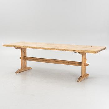 A pinewood trestle table, 18th Century.