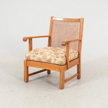 A 1940/50s rattan armchair.