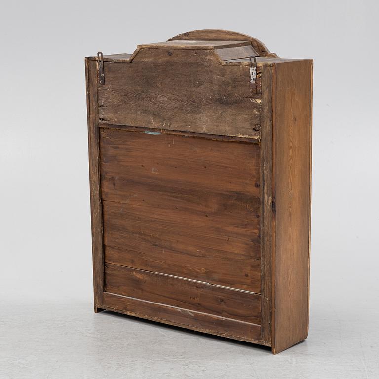 A 19th century wall hanged cabinet.