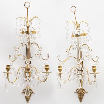 A pair of Gustavian-style two-light wall candleholders, circa 1900.