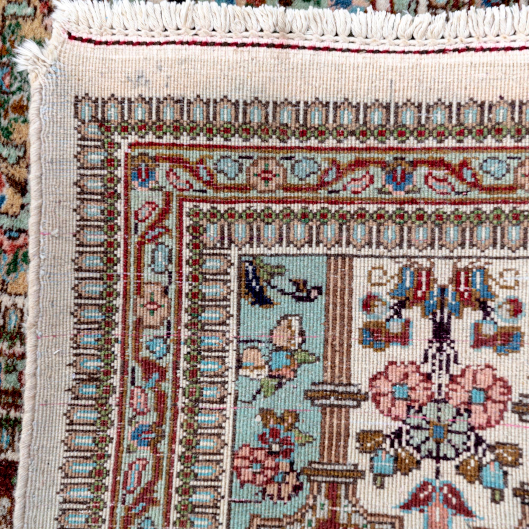 A semiantique signed Tabris carpet ca 364x262 cm.