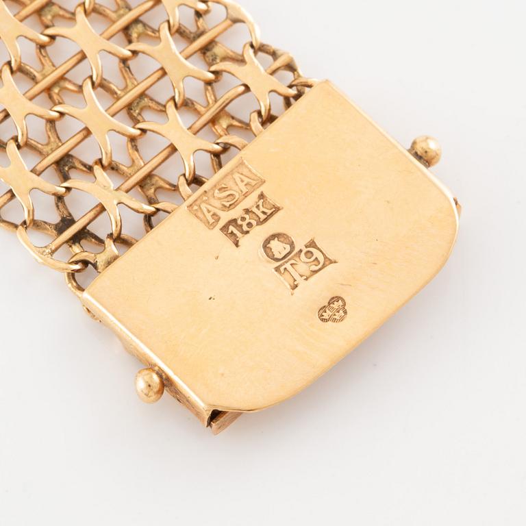 Armlänk, 18K guld, x-länk,  Ädelsmycken  AB, Stockholm 1969.