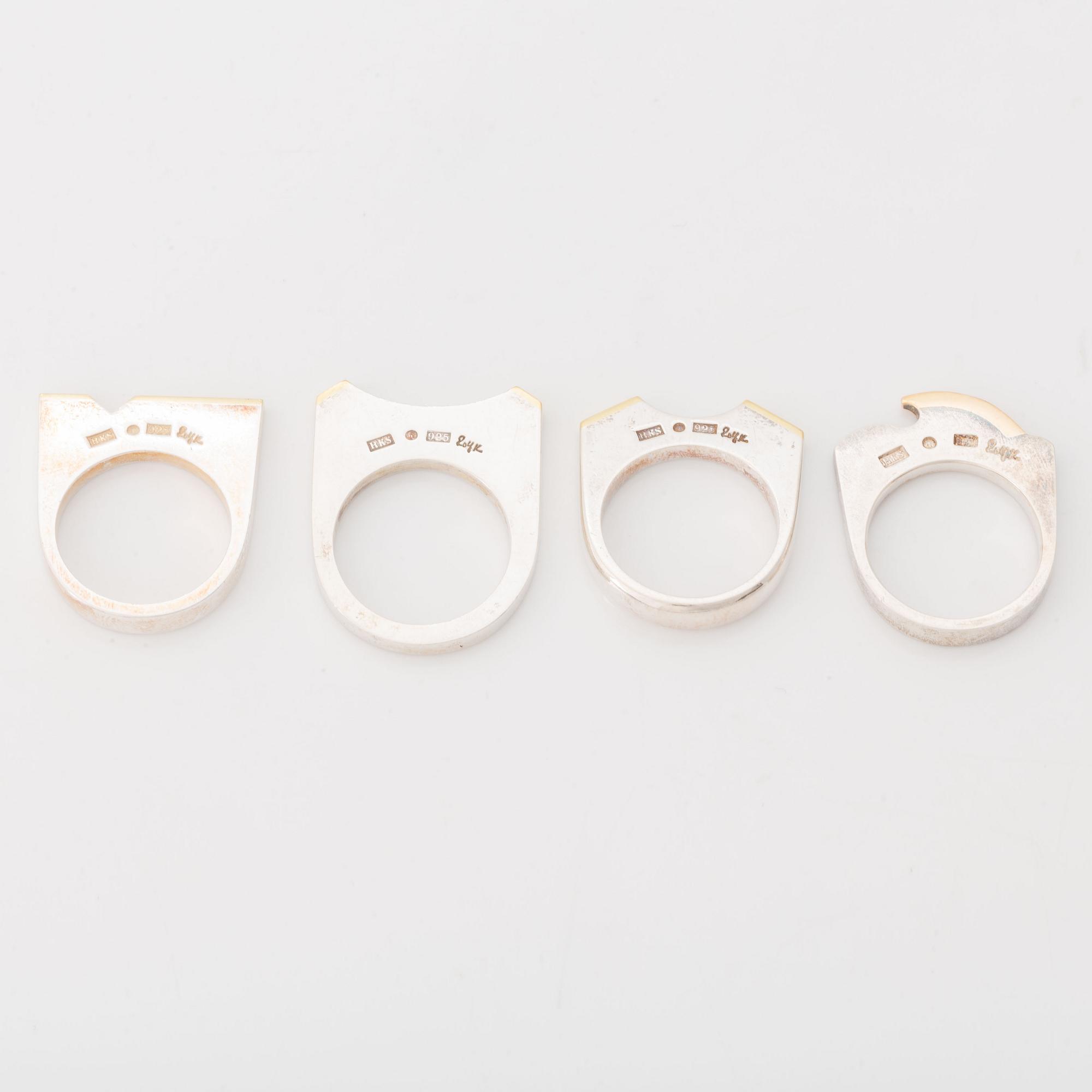 Rolf Karlsson four silver rings with gold details.