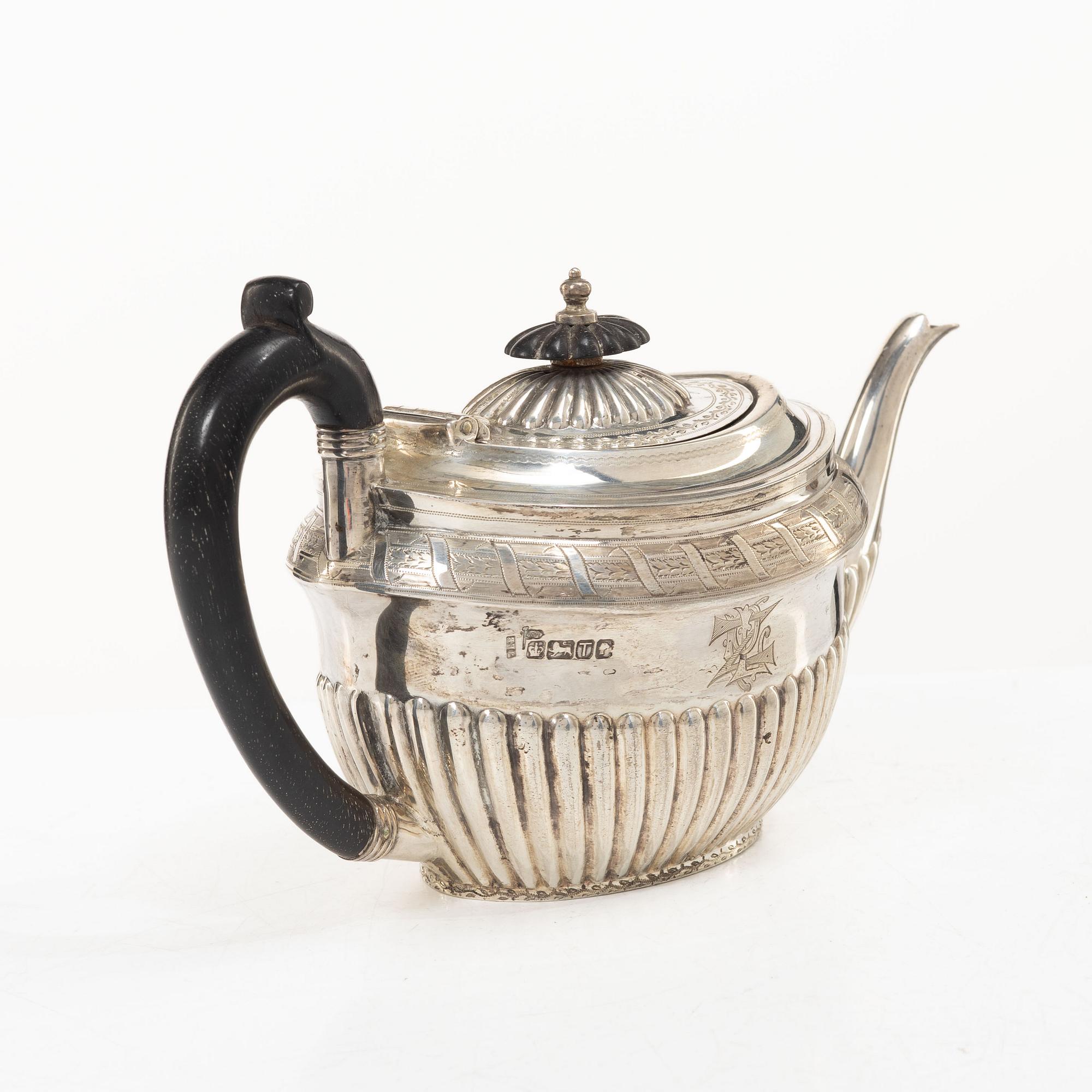 An English silver teapot, mark of Walker & Hall (John Edward Bingham), Sheffield, 1886.