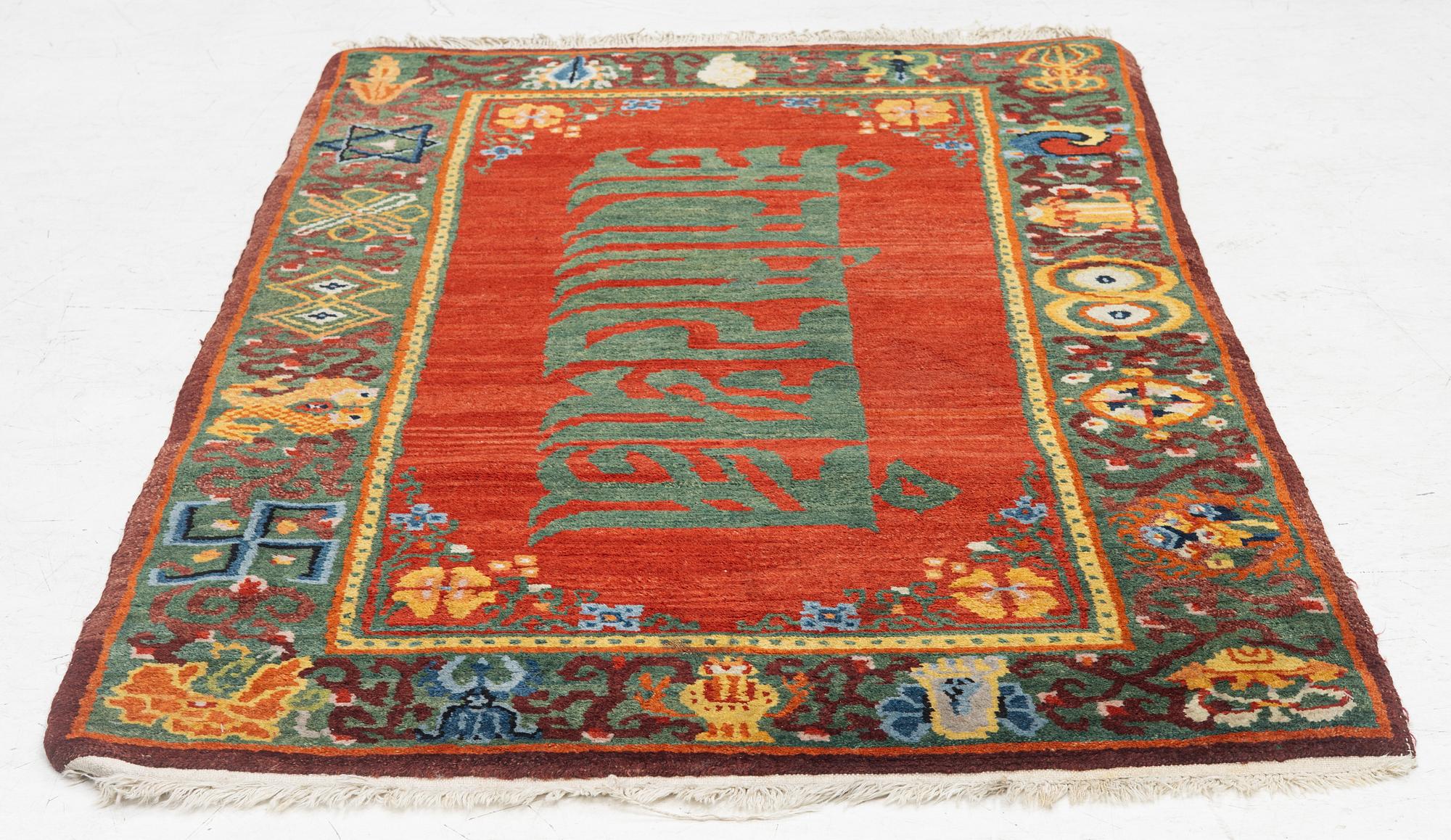 A Nepalese rug, c. 157 x 91cm.