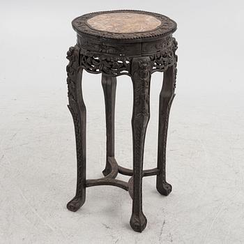 A Chinese wooden and stone table, 20th century.