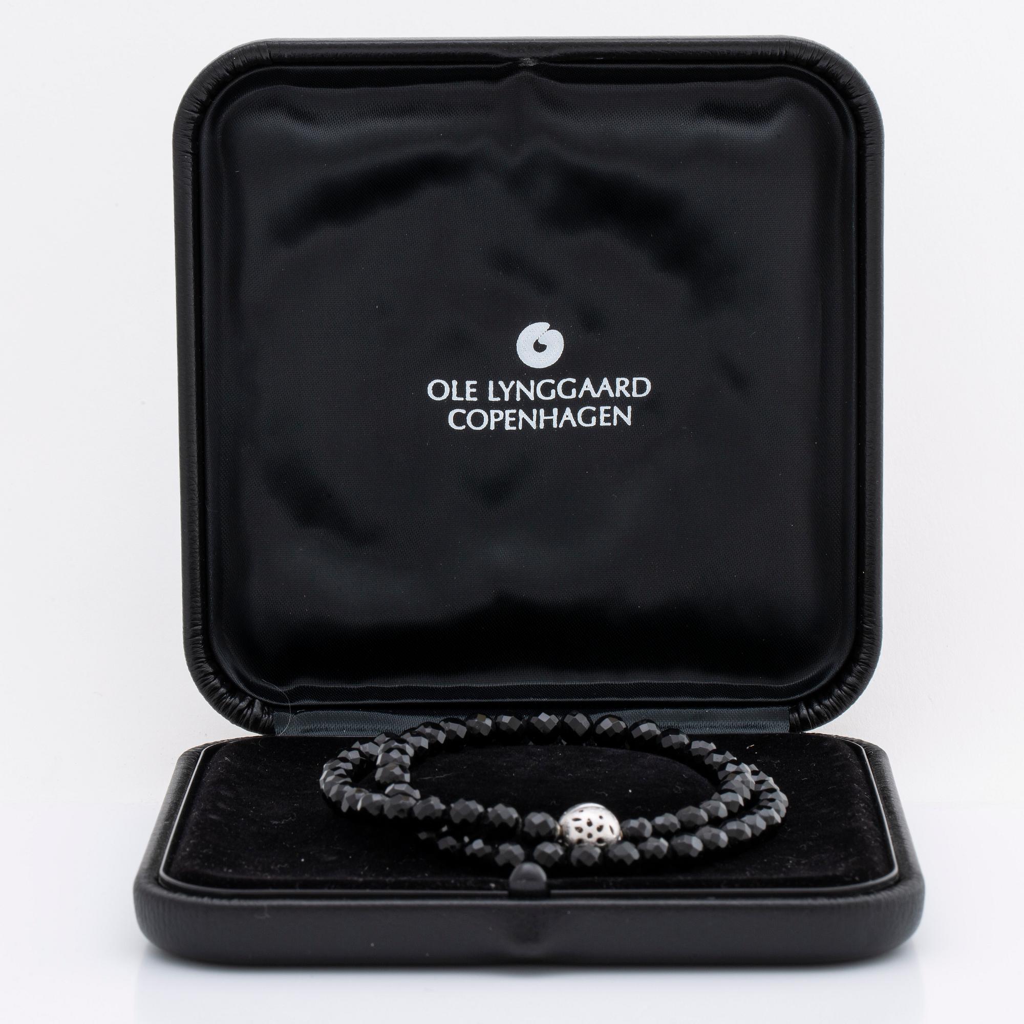 OLE LYNGGAARD necklace, onyx beads approx 6 mm, clasp 18K whitegold approx 10 mm, CL 750 inscribed, original case.