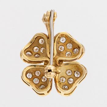 An 18K gold and diamond four-leaf clover brooch/pendant.