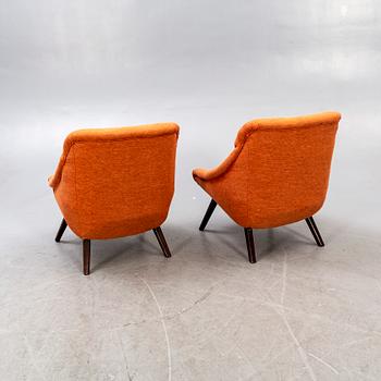 A pair of 1950s easy chairs.