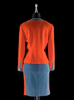 A two-piece orange bouclé and denim costume by Chanel.