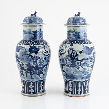 A pair of blue and white urns with covers, China, 19th century.