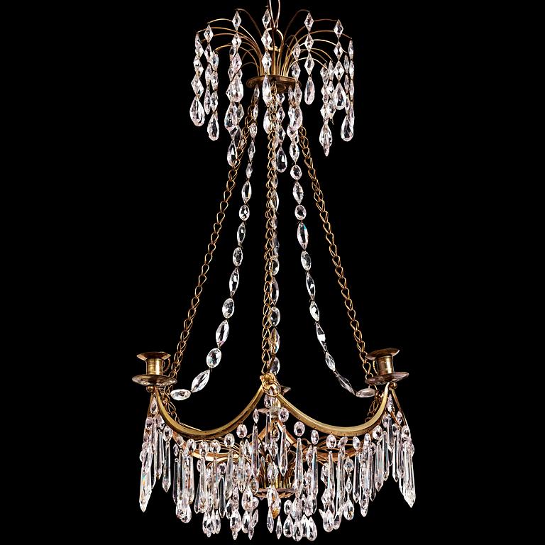 A Gustavian gilt brass and cut glass four-light chandelier, Stockholm, late 18th century.