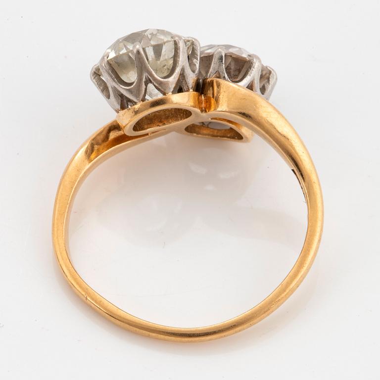 An 18K gold ring set with two old-cut diamonds with a total weight of ca 3.10 cts quality ca J/K si.