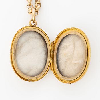 Öppningsbar medaljong med kedja, 18K guld.
