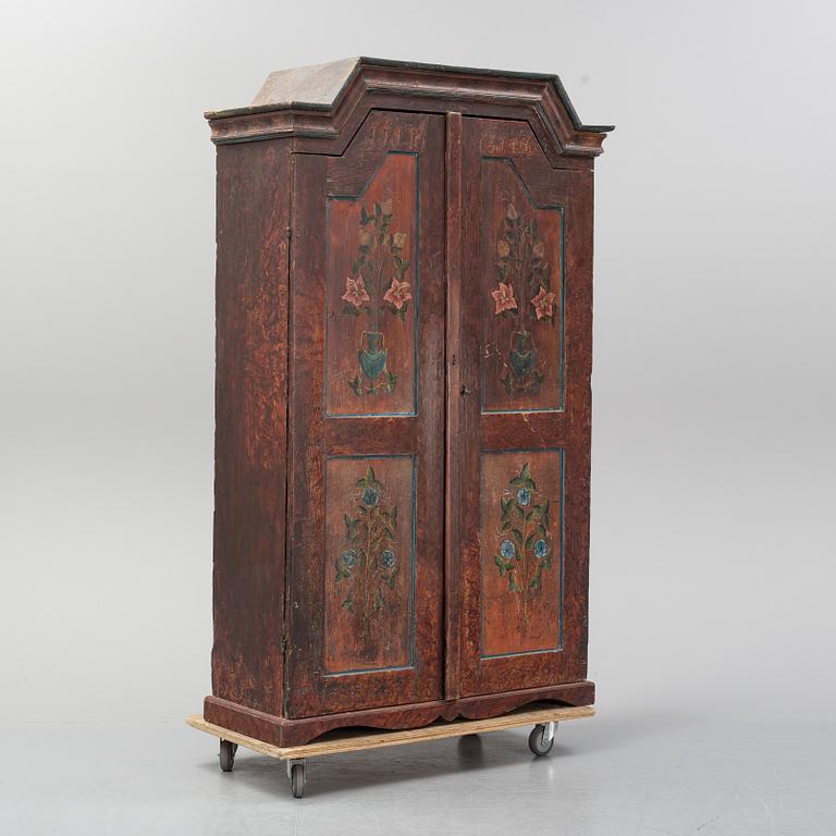 A Swedish painted cupboard dated 1863.