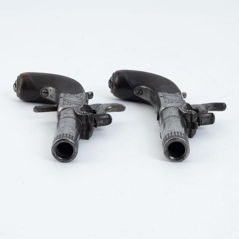 A pair of converted percussion pistols probably by Robert Smith, Uttoxeter 1821-53.