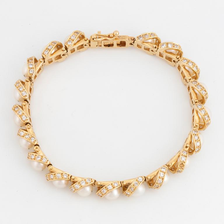 ARMBAND 14K guld, diamanter och pärlor.